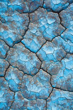 blue and brown cracks in the ground