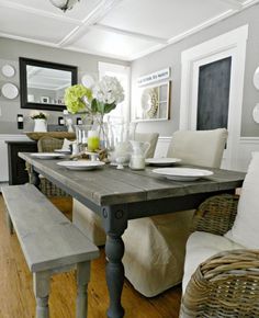 an image of a dining room table and bench in the middle of a living room