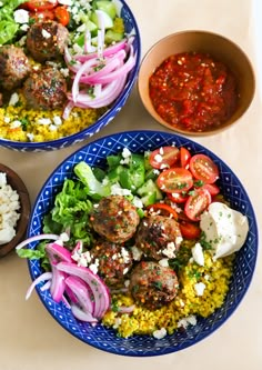 two bowls filled with meatballs, rice and veggies next to a bowl of salsa