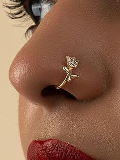 a woman's nose with a gold nose ring