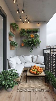 a living room filled with furniture and lots of greenery on the wall next to a balcony