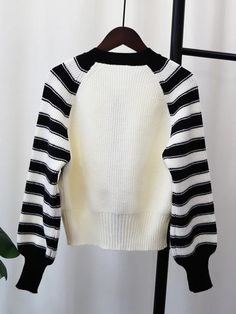 Fabric: Knit Trendy White Ribbed Sweater, White Ribbed Sweater For Spring, White Stretch Knitted Sweater, White Stretch Knit Sweater, White Ribbed Knit Sweater, White Chunky Knit Stretch Sweater, White Stretch Sweater With Chunky Knit, White Stretch Sweater With Textured Knit, Stretch White Sweater With Textured Knit