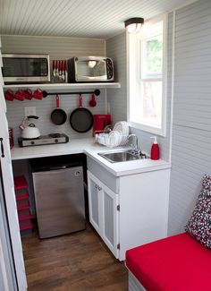 the small kitchen is clean and ready to be used as a place for cooking food