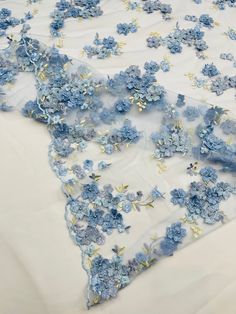 blue flowers on white sheer fabric