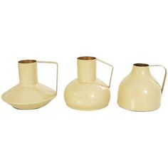 three cream colored vases with handles on white background