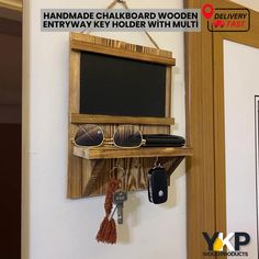 there is a wooden shelf with sunglasses and keys hanging on the wall next to it