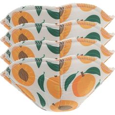 four pieces of cloth with oranges on them