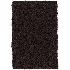 a black shaggy rug is shown on a white background and it looks like an area rug