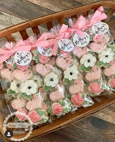 a basket filled with lots of decorated cookies