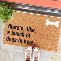 there's like a bunch of dogs in here door mat with shoes on it