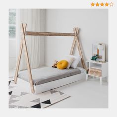 a bed with a wooden frame in a white room