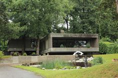 the house is surrounded by trees and water