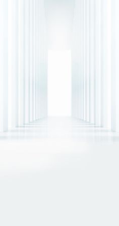 an empty white room with columns in the background