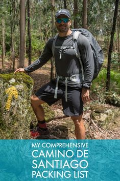 a man standing on top of a rock in the woods with text overlay reading my comprehensive camino de santiago packing list