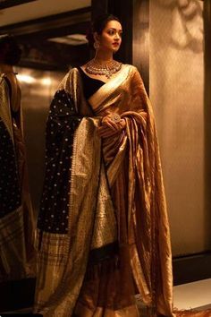 Gold toned choker with coin motifs, carved details and stone drops. Comes with carved round earrings and a ring.
Components: 1 Necklace, Pair of Earrings, 1 Ring
Type: Stones
Composition: Silver
Color: Gold
Carved details
Adjustable ring
Size (inch):
Necklace: 12
Earrings: 2.5 - Aza Fashions Actresses In Saree, Indian Lengha, Indian Sari Dress, Banarsi Saree, Classic Closet, Wedding Sari, Saree Poses, Sari Dress, Desi Aesthetic