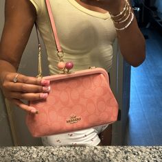 This Bag Is So Cute & Flattering. I Only Used It Twice Just Because I Got A Beige Purse That Is My Everyday Wear. I Love This Purse But, It Deserves To Be Put To Use! Trendy Clutch With Branded Hardware, Trendy Coach Evening Bags, Trendy Evening Coach Bag, Trendy Coach Clutch Bag, Feminine Coach Bags For Everyday Use, Pink Coach Clutch Bag, Chic Pouch Satchel With Branded Hardware, Chic Coach Satchel Pouch, Daily Use Coach Clutch Shoulder Bag