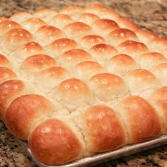 a loaf of bread sitting on top of a metal pan