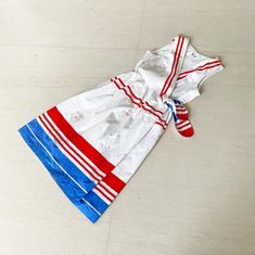 "Behold this WONDERFUL nautical inspired wrap dress from the 60s. Pristine white serves as the perfect backdrop for the red and blue stripes. This is a full wrap which ties inside and then again on the outside with a great striped tie. And wait, I left the best for last POCKETS ❤️💙❤️💙 Condition: Excellent Label: Tommies Bust 34-37\" (cos of the V wrap) Waist 25-28\" Length 42\" This item is clean and ready to wear. Comes from a smoke and pet free home. Don't forget to follow me on Instagram @t Peacock Dress, Gown Photos, Striped Tie, I Left, The 60s, Inspired Dress, Dress With Pockets, Dress Clothes For Women, New Vintage