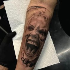 a person with a creepy face on their arm