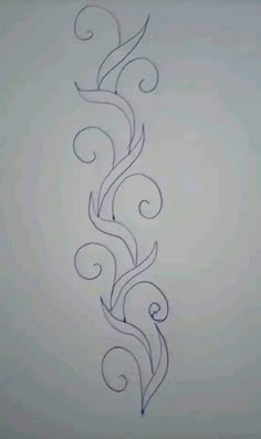 an artistic tattoo design on the side of a white wall with swirls and leaves