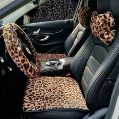 the interior of a car with leopard print cushions