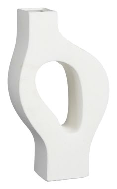 a white ceramic vase with a curved opening