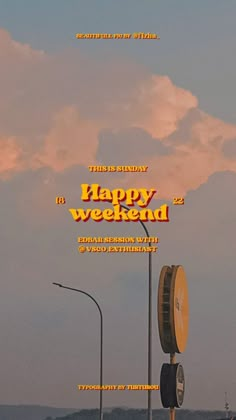 a sign that says happy weekend on the side of a road with clouds in the background