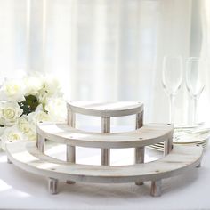 white flowers and wine glasses on a table