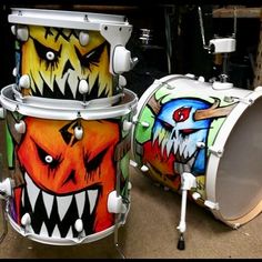 two drums with different designs painted on them