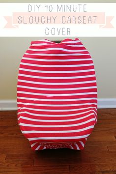 a red and white striped bag sitting on top of a wooden floor