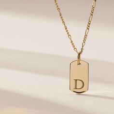 A twist on our best-selling Mini Dog Tag necklace. When it comes to personalizing, the possibilities are endless! Engrave the front + back with vertical initials, dates or any other numbers that are meaningful to you. Can’t choose just one? Add a tag for each special person or date! The Rounded Dog Tags are the perfect way to keep life’s special moments close. option to engrave 1-3 rows, uppercase only dog tag measures 16.4mm x 9mm hangs on your choice of an adjustable length diamond cut cable c Letter Necklace Initials, Tiny Tags, Mini Dog, Mini Dogs, Nameplate Necklace, Remembrance Gifts, Figaro Chain, Circle Necklace, Circle Pendant