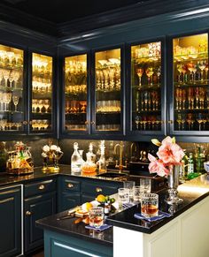 an instagramted photo of a kitchen with black cabinets