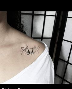 a woman with a small tattoo on her chest that says,'namita '