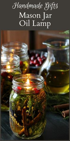 mason jar filled with candles and herbs on top of a table