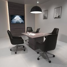 an office with two black chairs and a large table in front of a flat screen tv