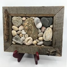 a wooden frame with rocks in it