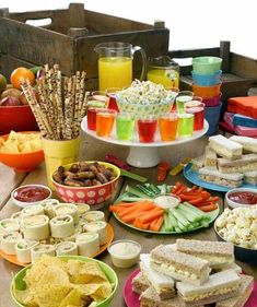 a table topped with lots of food and drinks