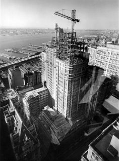 an aerial view of skyscrapers and construction cranes in new york city