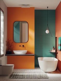 an orange and green bathroom with two sinks