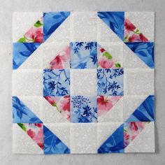 the block is made up of blue and pink flowers