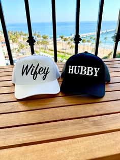 Wifey and Hubby Couple Trucker Hat, Engagement Hat, Honeymoon Hats The lettering is super unique raised velvety suede like texture!  Please message us with any ideas.  Front: 65% Polyester 35% Cotton  Back: 100% Polyester Mesh Structured Firm Front Panel 5 panel cap Seamless Front Panel with Full Buckram 6 Rows Stitching on Visor Matching Fabric Undervisor Matching Color Sweatband Plastic Adjustable Snap Size: OSFM - Adult (58cm/22.8") Couples Custom, Custom Hats, Trucker Cap, Color Matching, Caps Hats, Trucker Hat, The Row, Accessories Hats, Bathing Beauties