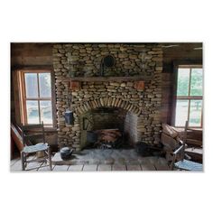 a stone fireplace in a wood paneled room