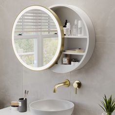 a bathroom sink with a round mirror above it and shelves on the wall behind it