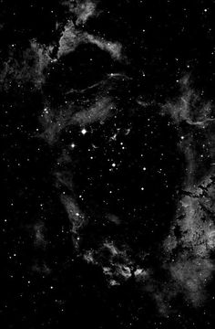 black and white photograph of the night sky with stars in it, as seen from space