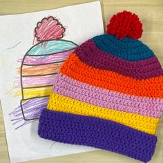 Stay warm and stylish with this customized, made-to-order, crochet beanie! Each piece is crocheted with care by hand. Get your custom beanie in just 3 easy steps!  1. Color in the coloring sheet with one color per section. 2. Snap a picture and send it via Etsy conversations. 3. Get your customized hat! After you complete your order, you will receive an email including a link to download and print the coloring sheets. Colors may vary slightly. For best results, we recommend taking a pictures of Multicolor Crochet Beanie Hat, Colorful Crochet Yarn Hat, Colorful Yarn Crochet Hat, Playful Crochet Winter Hat, Playful Winter Crochet Hat, Winter Crochet Crafts With Yarn, Beanie Design, Bonnet Au Crochet, Bonnet Crochet