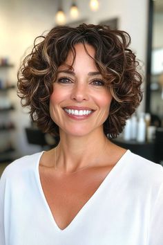 Short curly haircut for oval faces with natural volume and soft layers Subtle Highlights, Oval Faces