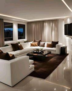 a living room filled with furniture and a flat screen tv mounted to the side of a wall