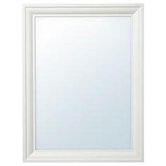 an empty white framed mirror on a white wall with clipping area for text or image