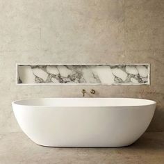 a large white bath tub sitting next to a mirror on the wall in a bathroom