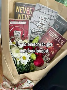 flowers and books in a paper bag with the words i want someone to give me a book bouquet